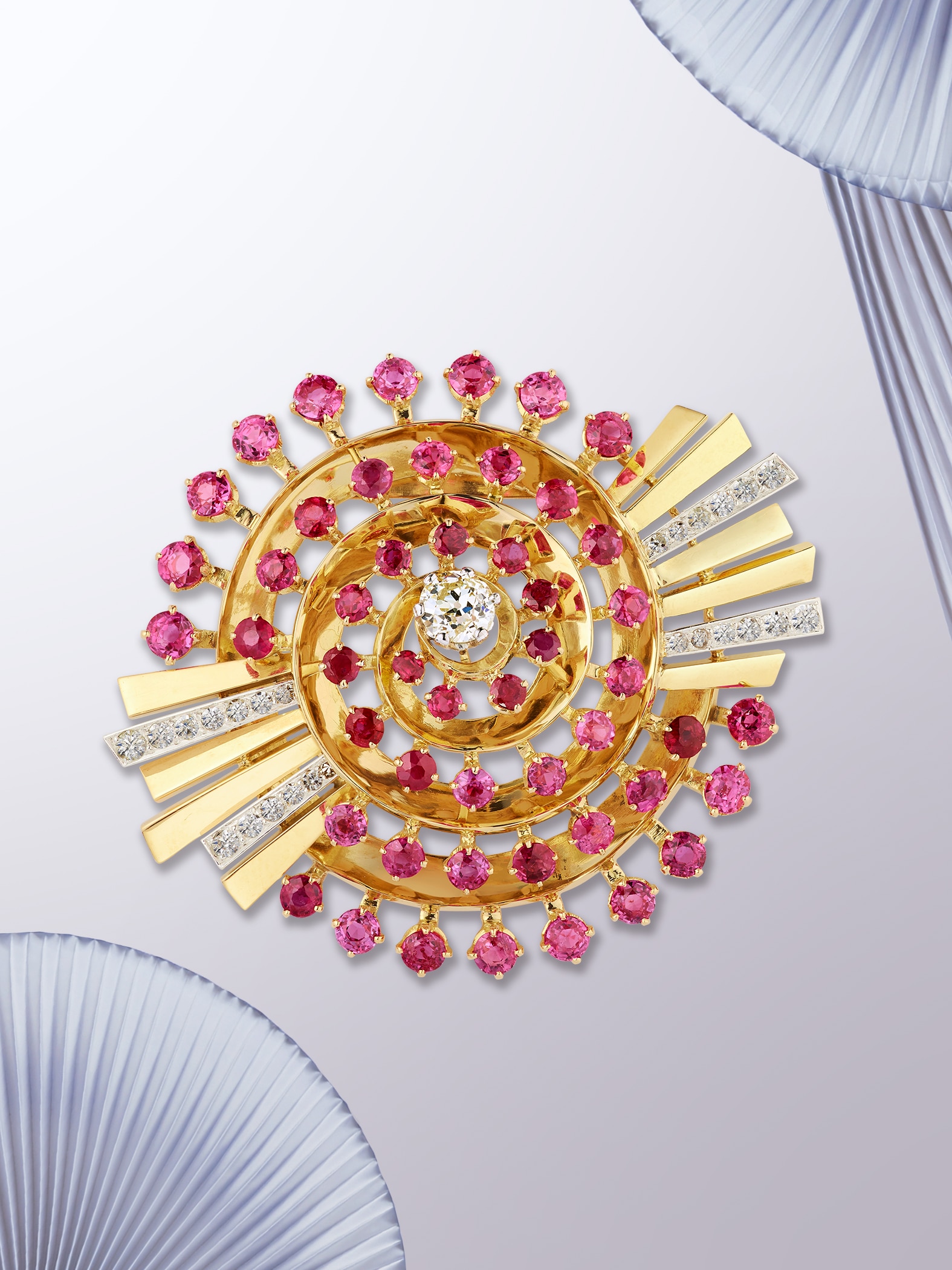 Spiral clip, 1942. Platinum, yellow gold, rose gold, rubies, diamonds. Van Cleef & Arpels Collection.